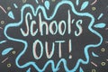 Text School`s Out written on chalkboard. Summer holidays