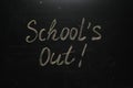 Text SCHOOL`S OUT written on blackboard. Summer holidays Royalty Free Stock Photo