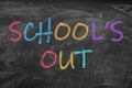 Text SCHOOL`S OUT written on blackboard Royalty Free Stock Photo