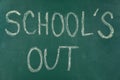 Text School`s Out written on chalkboard. Summer holidays