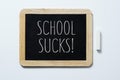 Text school sucks in a blackboard