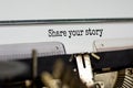 Text `share your story` typed on retro typewriter. Business concept. Copy space Royalty Free Stock Photo
