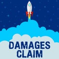 Text showing inspiration Damages Claim. Internet Concept Demand Compensation Litigate Insurance File Suit Rocket Ship Royalty Free Stock Photo