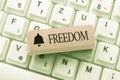 Text showing inspiration Freedom. Internet Concept liberty rather than in confinement or under physical restraint Typing