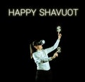 Hand writing sign Happy Shavuot. Conceptual photo Jewish holiday commemorating of the revelation of the Ten Commandments