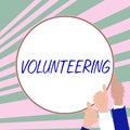 Text showing inspiration Volunteering. Business concept Provide services for no financial gain Willingly Oblige