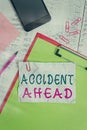 Text sign showing Accident Ahead. Conceptual photo Unfortunate event Be Prepared Detour Avoid tailgating Clipboard sheet pencil