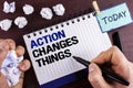 Text sign showing Action Changes Things. Conceptual photo doing something is like chain Improve Reflects written by Man on Notepad Royalty Free Stock Photo