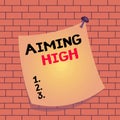 Text sign showing Aiming High. Conceptual photo a result that your plans or actions are intended to achieve Curved