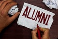 Text sign showing Alumni. Conceptual photo former pupil or student especially male one of particular school Man holding
