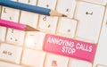 Text sign showing Annoying Calls Stop. Conceptual photo Prevent spam phones Blacklisting numbers Angry caller White pc