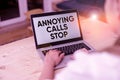 Text sign showing Annoying Calls Stop. Conceptual photo Prevent spam phones Blacklisting numbers Angry caller woman