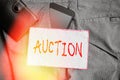 Text sign showing Auction. Conceptual photo Public sale Goods or Property sold to highest bidder Purchase Smartphone device inside