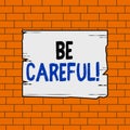 Text sign showing Be Careful. Conceptual photo making sure of avoiding potential danger mishap or harm Wooden square