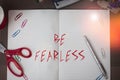 Text sign showing Be Fearless. Conceptual photo act of living in spite of those things that scare you to death Scissors and