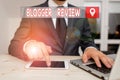 Text sign showing Blogger Review. Conceptual photo making a critical reconsideration and summary of a blog Male human wear formal Royalty Free Stock Photo