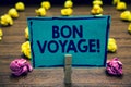 Text sign showing Bon Voyage. Conceptual photo used express good wishes to someone about set off on journey Clothespin holding blu Royalty Free Stock Photo