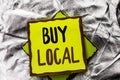Text sign showing Buy Local. Conceptual photo Buying Purchase Locally Shop Store Market Buylocal Retailers written on Stacked Stic Royalty Free Stock Photo