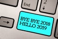 Text sign showing Bye Bye 2018 Hello 2019. Conceptual photo Starting new year Motivational message 2018 is over Silver grey comput