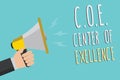 Text sign showing C.O.E Center Of Excellence. Conceptual photo being alpha leader in your position Achieve Man holding megaphone l