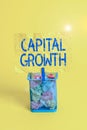 Text sign showing Capital Growth. Conceptual photo increase in the value of an asset or investment over time Trash bin crumpled