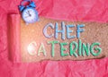 Text sign showing Chef Catering. Conceptual photo Provides services, food and beverages for various events Alarm clock and torn