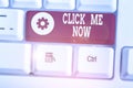 Text sign showing Click Me Now. Conceptual photo Internet helping desk Press the button Online Icon Nertwork. Royalty Free Stock Photo