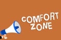 Text sign showing Comfort Zone. Conceptual photo A situation where one feels safe or at ease have Control Man holding megaphone lo