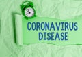 Text sign showing Coronavirus Disease. Conceptual photo defined as illness caused by a novel virus SARSCoV2 Rolled