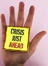 Text sign showing Crisis Just Ahead. Conceptual photo Foresee failure take right action before it is late written on Yellow Sticky Royalty Free Stock Photo