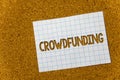 Text sign showing Crowdfunding. Conceptual photo Funding a project by raising money from large number of people Cork background no