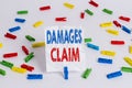 Text sign showing Damages Claim. Conceptual photo Deanalysisd Compensation Litigate Insurance File Suit Colored clothespin papers