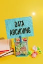 Text sign showing Data Archiving. Conceptual photo to secure and to store data for long term retention Trash bin crumpled paper