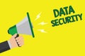 Text sign showing Data Security. Conceptual photo Confidentiality Disk Encryption Backups Password Shielding Man holding megaphone