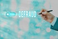 Text sign showing Defraud. Conceptual photo to trick or cheat someone or something in order to get money