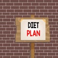 Text sign showing Diet Plan. Conceptual photo detailed proposal for doing or achieving a heathy eating habit Wood plank