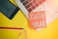 Text sign showing Disaster Ahead. Conceptual photo Contingency Planning Forecasting a disaster or incident Trendy laptop Royalty Free Stock Photo