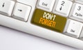 Text sign showing Don T Forget. Conceptual photo used to remind someone about an important fact or detail White pc keyboard with Royalty Free Stock Photo