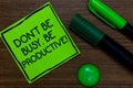 Text sign showing Don t not Be Busy. Be Productive. Conceptual photo Work efficiently Organize your schedule time Written on stick Royalty Free Stock Photo