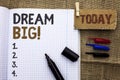 Text sign showing Dream Big. Conceptual photo Motivation Plan Aim Dream Vision Strategy Challenge Idea written on Notebook Book Wi