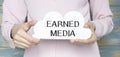 Text sign showing Earned Media. Conceptual photo Publicity gained through promotional efforts by multimedia Man holds