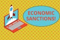 Text sign showing Economic Sanctions. Conceptual photo Penalty Punishment levied on another country Trade war Rocket