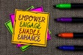 Text sign showing Empower Engage Enable Enhance. Conceptual photo Empowerment Leadership Motivation Engagement Written on some col Royalty Free Stock Photo