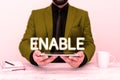 Text sign showing Enable. Business concept give someone or something the authority or means to do something