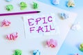 Text sign showing Epic Fail. Conceptual photo a spectacularly embarrassing mistake Humiliating situation Colored crumpled papers
