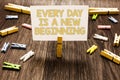 Text sign showing Every Day Is A New Beginning. Conceptual photo you have a chance to dream work live better Clothespin holding wh