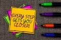 Text sign showing Every Step Gets You Closer. Conceptual photo Keep moving to reach your goals objectives Written on some colorful