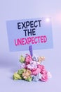 Text sign showing Expect The Unexpected. Conceptual photo Anything can Happen Consider all Possible Events Reminder pile
