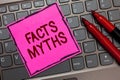 Text sign showing Facts Myths. Conceptual photo work based on imagination rather than on real life difference Pink paper keyboard