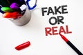 Text sign showing Fake Or Real. Conceptual photo checking if products are original or not checking quality Pen white background gr Royalty Free Stock Photo